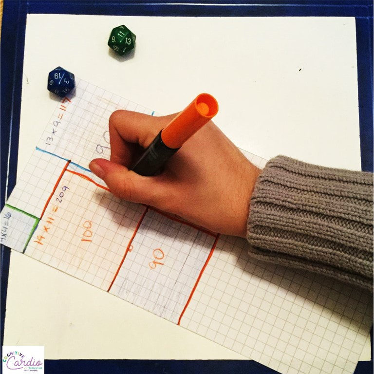 student drawing a shape during array game